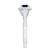 Round 0.9 carat blue sapphire antique engagement ring with diamond halo and intricate gold band by Rosec Jewels.