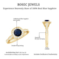 Round 0.9 carat blue sapphire antique engagement ring with diamond halo by Rosec Jewels, featuring intricate vintage design.