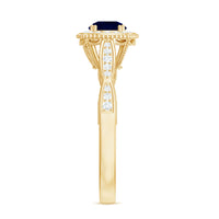Round 0.9 carat blue sapphire antique engagement ring with diamond halo and intricate metalwork from Rosec Jewels.