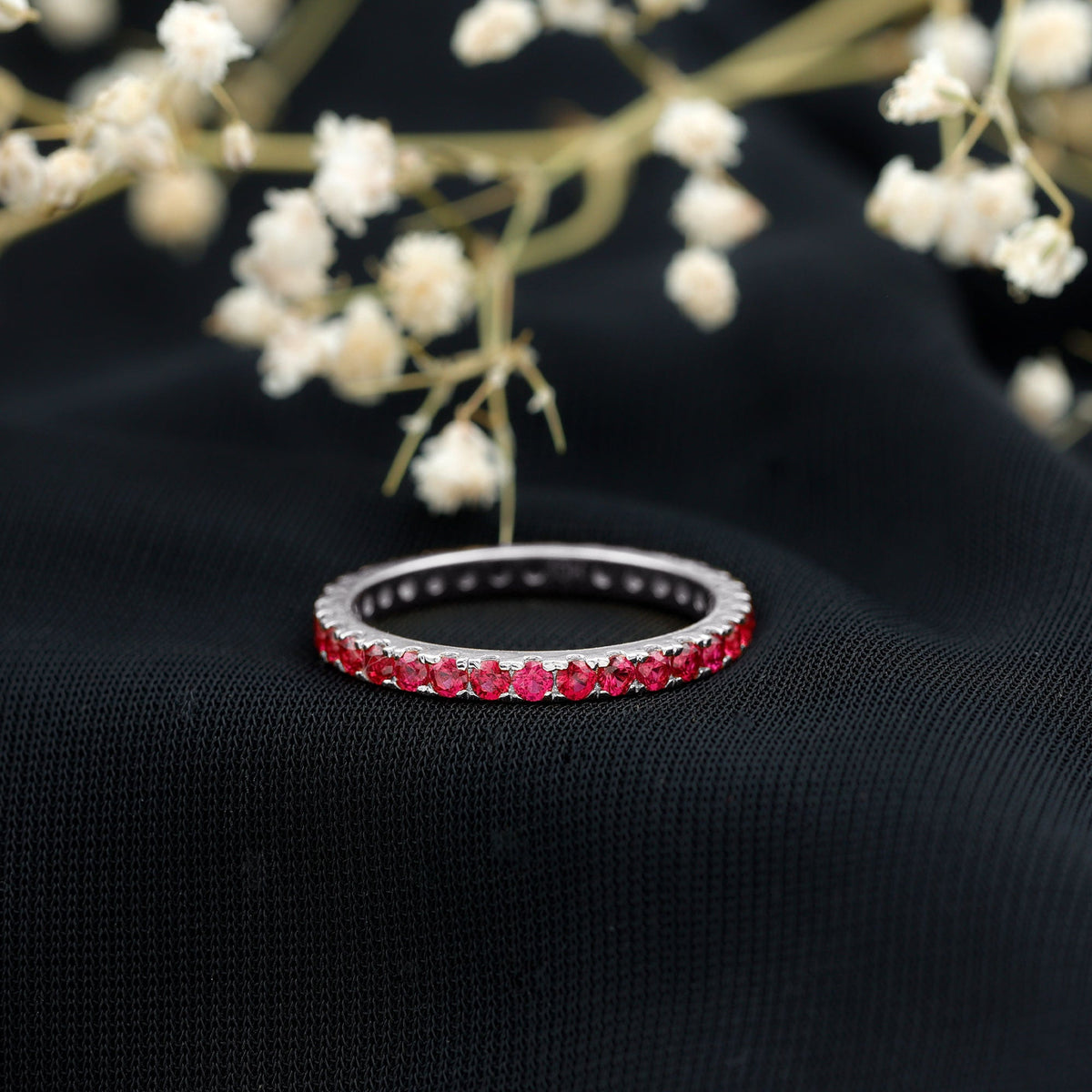 Rosec Jewels French pave set lab-grown ruby stackable eternity ring with sparkling ruby accents and a sleek band design.