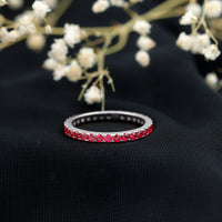 Rosec Jewels French pave set lab-grown ruby stackable eternity ring with sparkling ruby accents and a sleek band design.