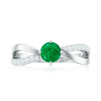 Real emerald infinity promise ring with diamond detail, crafted by Rosec Jewels, featuring a sleek band and sparkling gemstones.