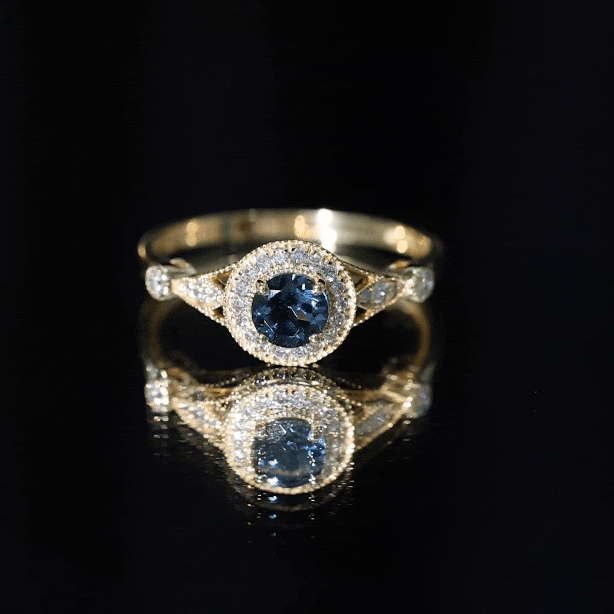 Antique-style engagement ring featuring a 0.6 carat London Blue Topaz center stone with diamond halo, by Rosec Jewels.