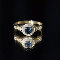 Antique-style engagement ring featuring a 0.6 carat London Blue Topaz center stone with diamond halo, by Rosec Jewels.