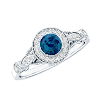 Antique engagement ring with 0.6 carat London Blue Topaz and diamond halo, featuring intricate vintage-style detailing.