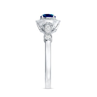 Rosec Jewels 0.6 carat London Blue Topaz antique engagement ring with diamond halo, showcasing intricate vintage design and sparkling stones.