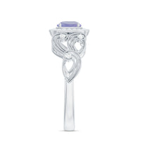Vintage Tanzanite engagement ring with diamond halo, featuring intricate metalwork and sparkling gemstone from Rosec Jewels.