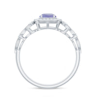 Vintage-style Tanzanite engagement ring with diamond halo from Rosec Jewels, featuring a central tanzanite gemstone and detailed band.