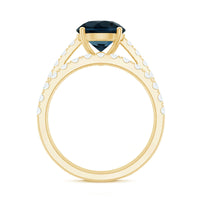 Two-carat round London Blue Topaz solitaire rings set with Moissanite bands, featuring elegant silver finishes and intricate detailing.