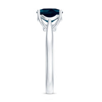 Solitaire cushion cut London Blue Topaz cathedral engagement ring by Rosec Jewels featuring a prominent blue topaz stone and elegant band.