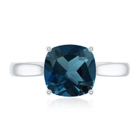 Solitaire cushion cut London Blue Topaz engagement ring with cathedral setting by Rosec Jewels.