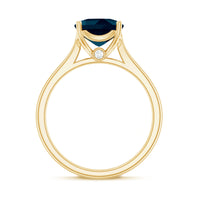 Solitaire cushion cut London Blue Topaz engagement ring with cathedral setting from Rosec Jewels, showcasing the blue gemstone and elegant band.