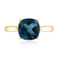 Solitaire cushion cut London Blue Topaz engagement ring by Rosec Jewels with cathedral setting and sterling silver band.