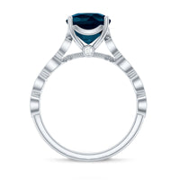 Vintage engagement ring featuring a cushion cut London Blue Topaz and diamond accents, crafted by Rosec Jewels.