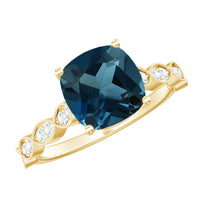 Vintage engagement ring featuring a cushion cut London Blue Topaz center stone with diamond accents, from Rosec Jewels.