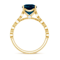 Vintage engagement ring featuring a cushion cut London Blue Topaz gemstone and sparkling diamonds, set in a detailed Rosec Jewels ring.