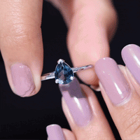 Pear-shaped 1 carat London Blue Topaz engagement ring by Rosec Jewels, showcasing the vibrant blue gemstone and elegant band.