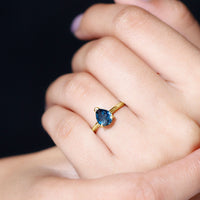 Pear shape London Blue Topaz engagement ring with a single stone, set in a silver band, from Rosec Jewels.