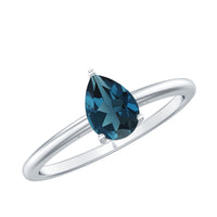 Pear-shaped London Blue Topaz solitaire ring with silver band by Rosec Jewels, showcasing the vibrant blue gemstone and elegant design.