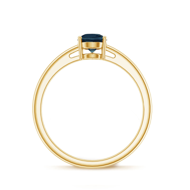 Pear-shaped London Blue Topaz solitaire ring with a silver band, featuring a 5x7mm blue gemstone, designed by Rosec Jewels.