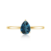 Pear-shaped London Blue Topaz solitaire ring in 5x7mm size, featuring a sterling silver band from Rosec Jewels.