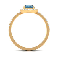 Oval cut London Blue Topaz engagement ring with diamond halo by Rosec Jewels, showcasing the elegant gemstone and intricate band design.