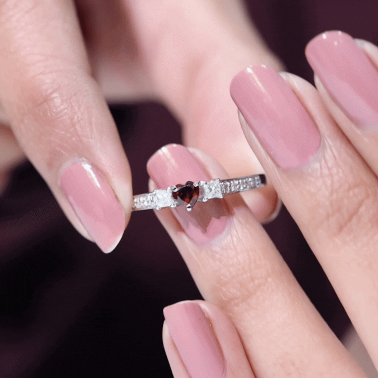 Yellow gold heart-shaped promise ring with natural garnet and diamond accent, designed by Rosec Jewels.