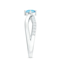 Genuine aquamarine engagement ring with diamond infinity shank from Rosec Jewels, featuring a central blue aquamarine gemstone and sparkling diamonds.