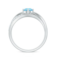 Genuine aquamarine engagement ring with diamond infinity shank by Rosec Jewels, featuring a central aquamarine gemstone and sparkling diamond accents.