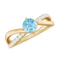 Genuine aquamarine engagement ring with diamond infinity shank, featuring a central aquamarine gemstone and intricate diamond band design.