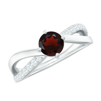 Natural garnet engagement ring with diamond infinity shank, featuring a rose gold band and intricate detailing from Rosec Jewels.