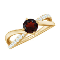 Natural garnet engagement ring with diamond infinity shank, showcasing a detailed rose gold band and sparkling gemstone accents.