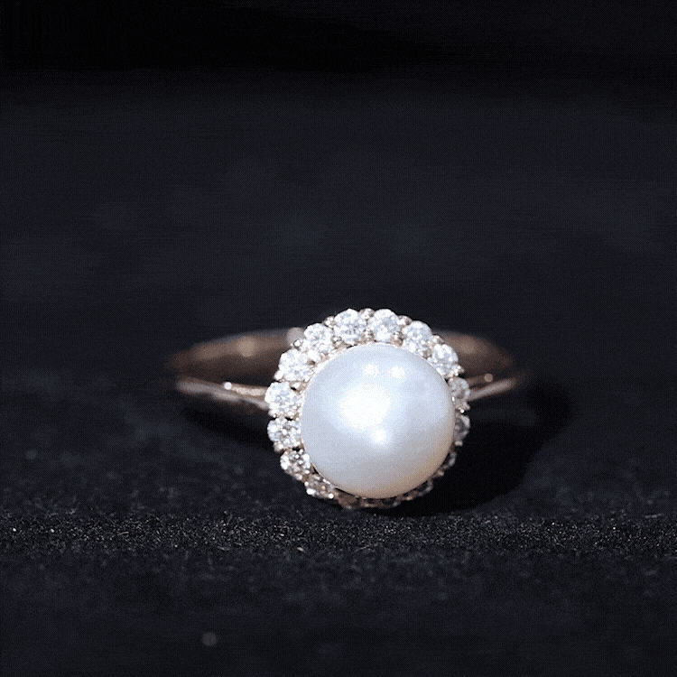 Yellow gold freshwater pearl engagement ring with a diamond halo, featuring a 7.4-carat pearl by Rosec Jewels.