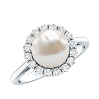 Freshwater pearl engagement ring with diamond halo by Rosec Jewels, showcasing a 7.4-carat pearl and sparkling diamond accents.