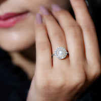 Rosec Jewels freshwater pearl engagement ring with a 7.4-carat pearl and diamond halo, showcasing elegant jewelry design.