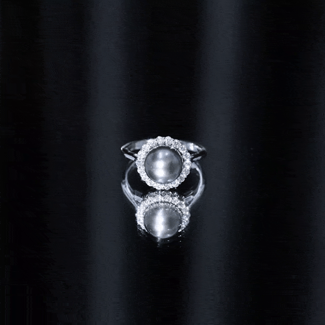 Natural Tahitian pearl and diamond halo engagement ring by Rosec Jewels featuring a large central pearl surrounded by sparkling diamonds.
