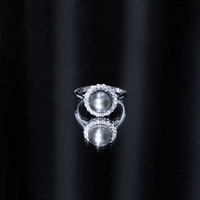 Natural Tahitian pearl and diamond halo engagement ring by Rosec Jewels featuring a large central pearl surrounded by sparkling diamonds.