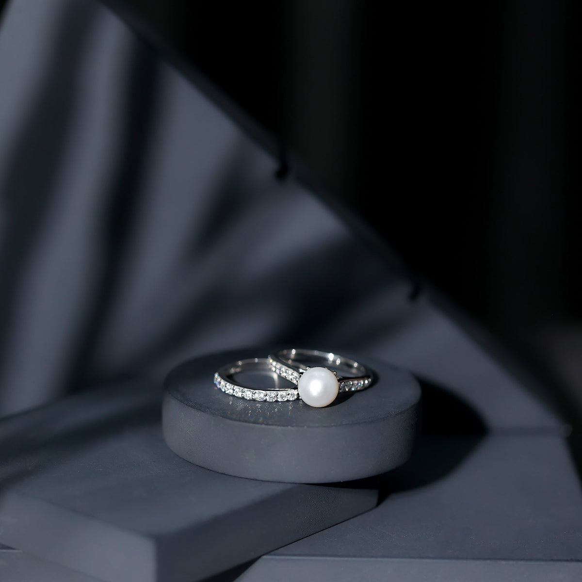 Natural white pearl bridal ring set with moissanite from Rosec Jewels, featuring elegant rings with pearl and sparkling stones.