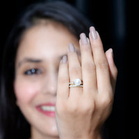 Elegant white pearl wedding bridal ring set with moissanite stones by Rosec Jewels, showcasing sparkling rings on a white background.