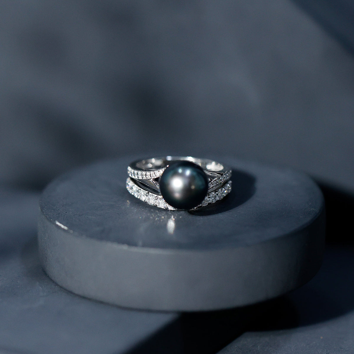 Rosec Jewels designer Tahitian black pearl and moissanite wedding ring set, featuring elegant rings with intricate details.
