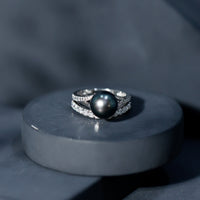 Rosec Jewels designer Tahitian black pearl and moissanite wedding ring set, featuring elegant rings with intricate details.