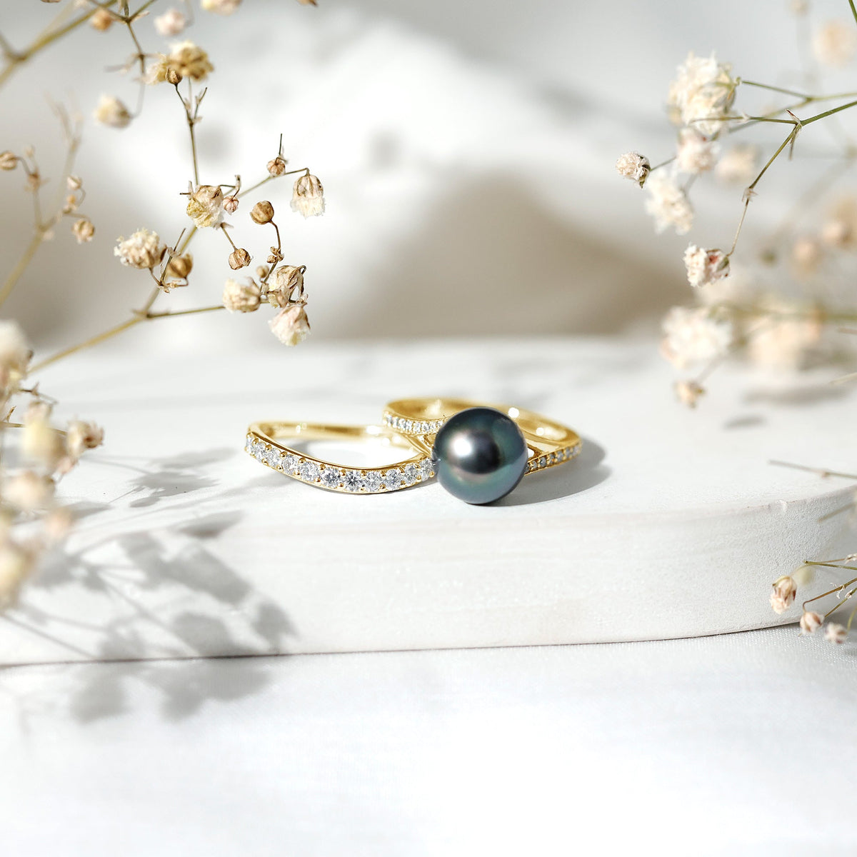 Elegant designer Tahitian black pearl wedding ring set with moissanite from Rosec Jewels, showcasing intricate ring designs.