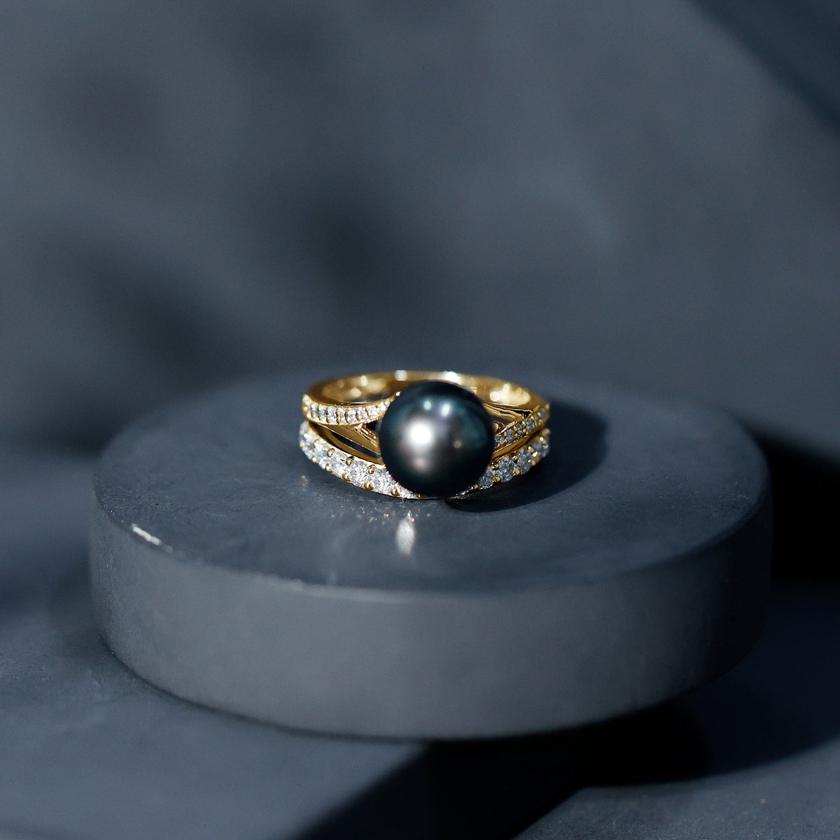Elegant designer Tahitian black pearl wedding ring set with sparkling moissanite stones, crafted by Rosec Jewels.