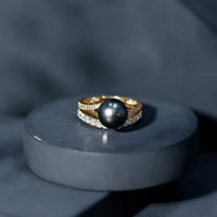 Elegant designer Tahitian black pearl wedding ring set with sparkling moissanite stones, crafted by Rosec Jewels.