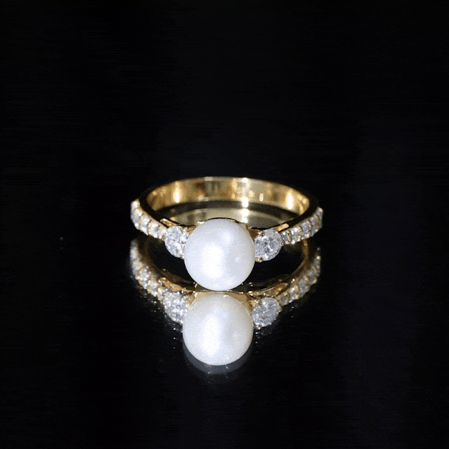 Cultured 7.4 carat freshwater pearl engagement ring with moissanite stones, set in a elegant ring from Rosec Jewels.