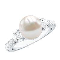 Rosec Jewels cultured 7.4 carat freshwater pearl engagement ring with sparkling moissanite, featuring a sleek band and elegant design.