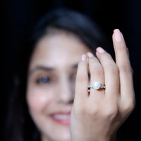 Elegant rose gold engagement ring featuring a 7.4 carat freshwater pearl and moissanite accents by Rosec Jewels.