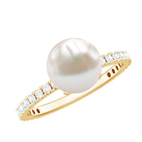 Rosec Jewels 7.4 Carat freshwater pearl solitaire engagement ring with a diamond, featuring a sleek gold band and elegant design.