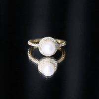 Cultured 7.4 carat freshwater pearl diamond engagement ring with halo setting by Rosec Jewels, featuring a detailed silver band.