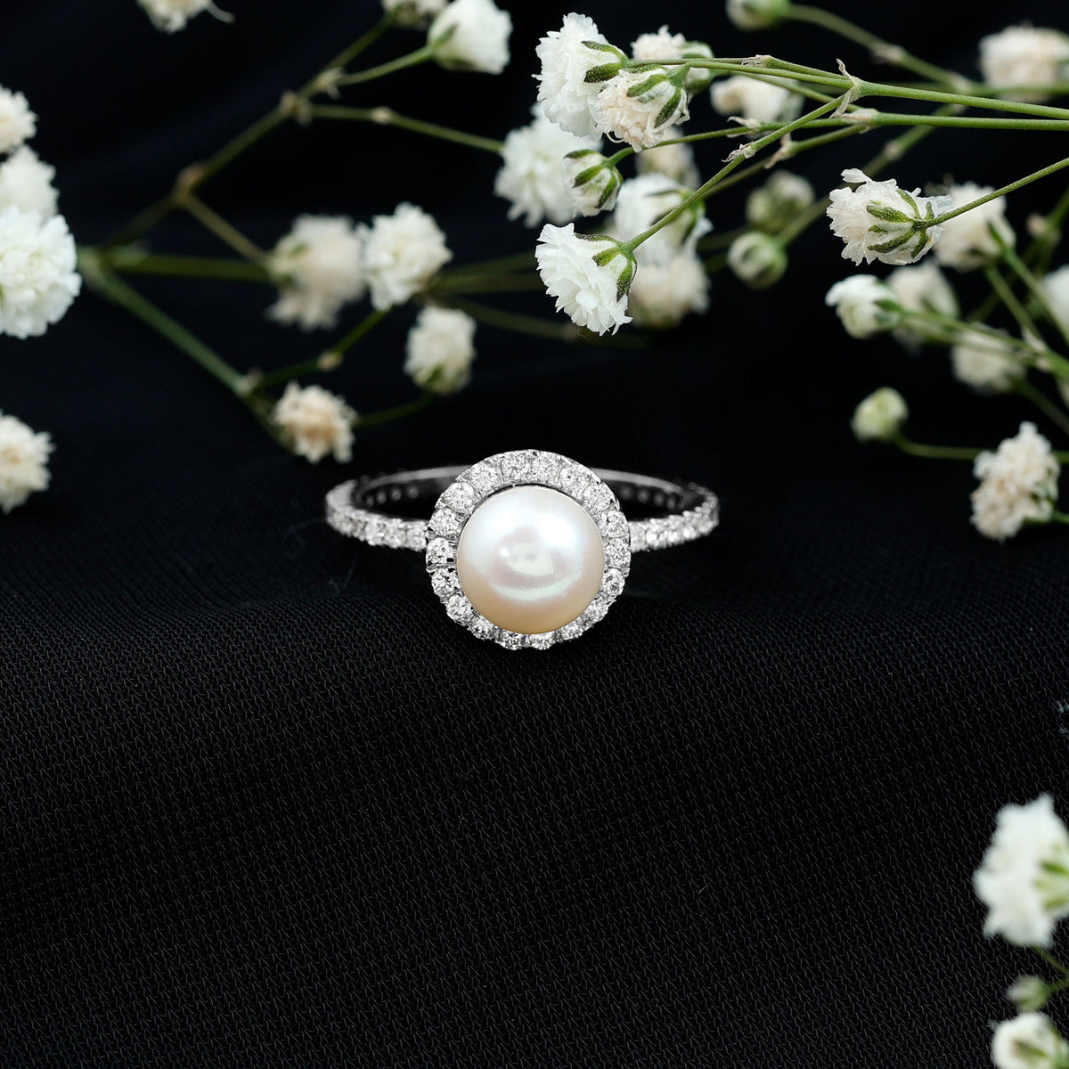 Rosec Jewels cultured 7.4 carat freshwater pearl diamond engagement ring with halo, featuring a central pearl surrounded by sparkling diamonds.